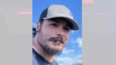 Police discover body suspected as American father accused of killing his three girls
